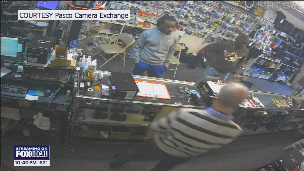 Search for duo after camera store robbery